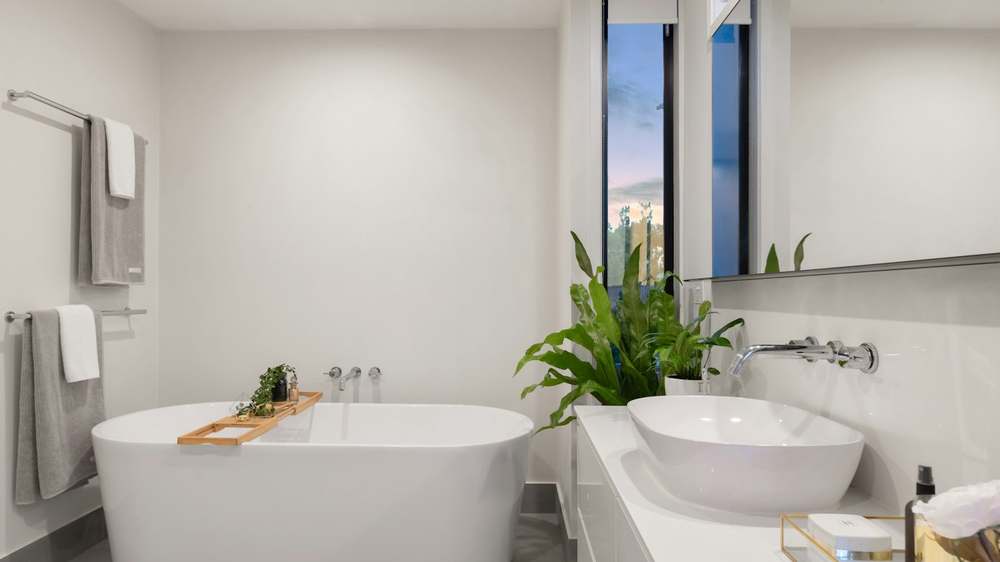 A calm, clear bathroom counter with only daily items on display