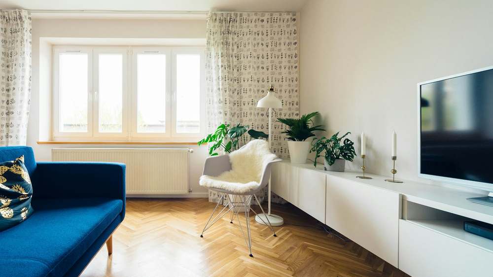 A bright rental living space with freestanding storage that requires no wall fixings